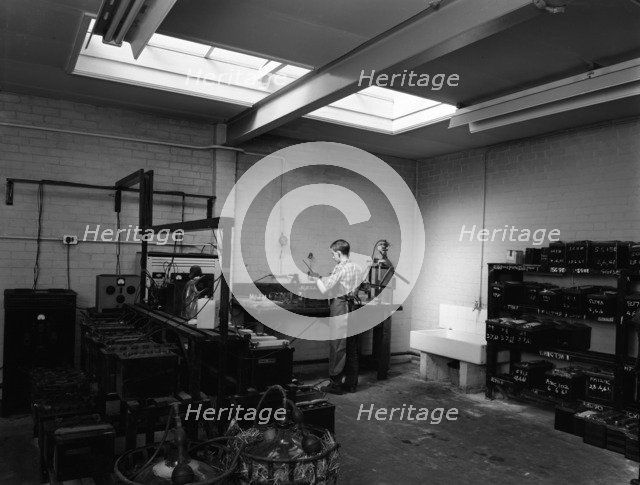 Scene in the workshops of Globe & Simpson auto electricians, Lincoln, Lincolnshire, 1961. Artist: Michael Walters