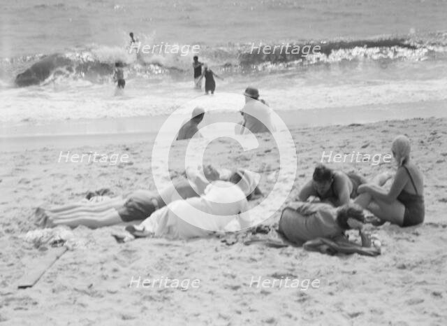 Unidentified group of people, possibly members of the Jewett family, at the beach, c1911-1942. Creator: Arnold Genthe.