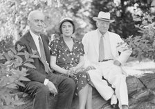 Timken, W.R., Mr. and Mrs., and John Hemming Fry, seated outdoors, 1938 July. Creator: Arnold Genthe.