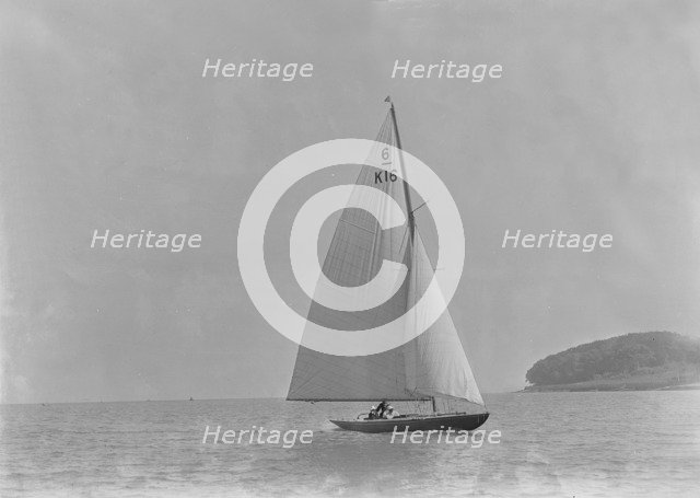 The 6 Metre class 'Jean' (K16) sailing in light winds, 1921. Creator: Kirk & Sons of Cowes.