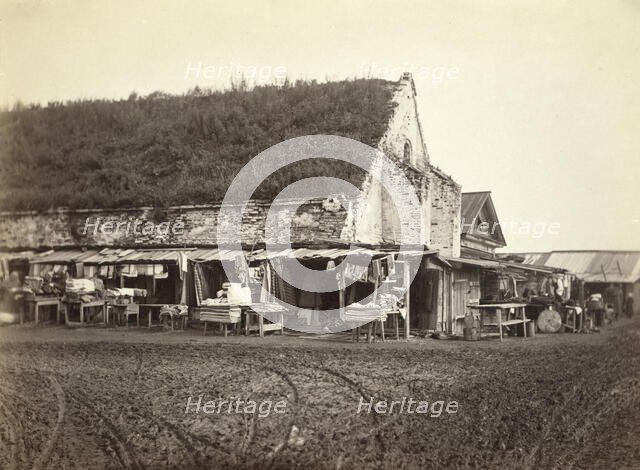 Market stalls beside old powder magazine, Irkutsk, between 1885 and 1886. Creator: Unknown.