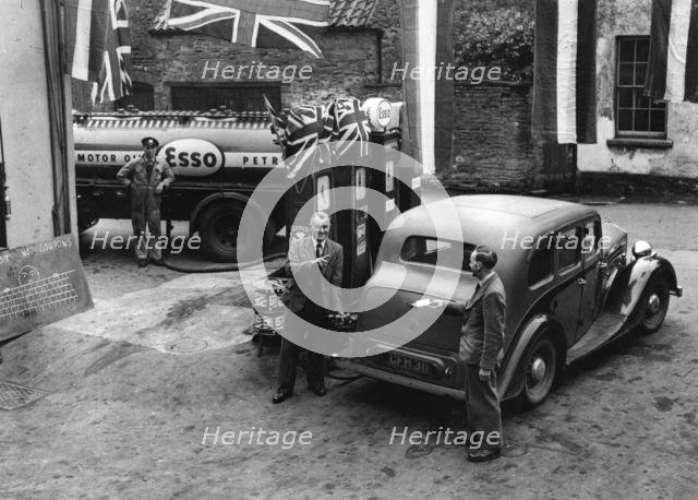 Esso garage at the end of petrol rationing 1950. Creator: Unknown.