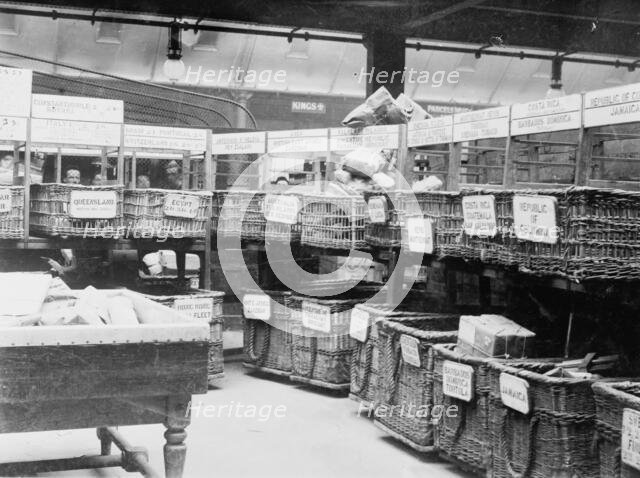 British Parcels Post-sorting parcels for foreign mail, between c1910 and c1915. Creator: Bain News Service.