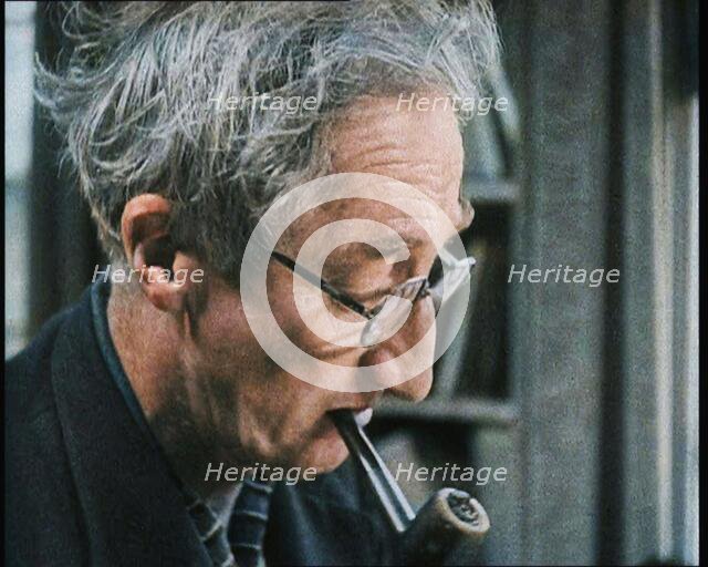 A.P. Herbert Smoking a Pipe, 1930s. Creator: British Pathe Ltd.