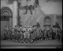Scene from a Stage Show: Male and Female Civilians Dancing on a Stage in a Routine with..., 1929. Creator: British Pathe Ltd.