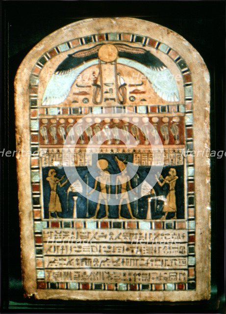 Stela in wood representing the deceased Ba-s-Turefi before the god Atum and Ra-Haharchte, from Th…