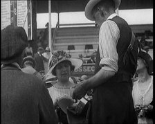 A Female Civilian Placing a Bet with a Bookie in a Horse Racing Event, 1920. Creator: British Pathe Ltd.