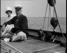 A Man and a Woman Sitting on the Deck of a Yacht at  Cowes, 1933. Creator: British Pathe Ltd.