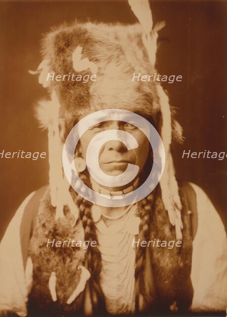 Nez Percé with furcap, c1904. Creator: Edward Sheriff Curtis.