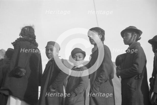 Possibly: Negroes in the lineup for food at meal time in the camp..., Forrest City, Arkansas, 1937. Creator: Walker Evans.