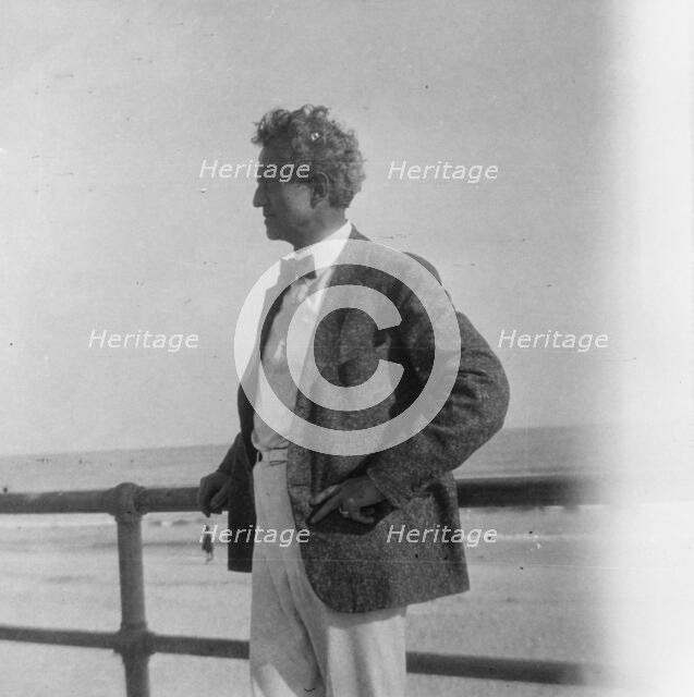 Arnold Genthe at the beach, between 1896 and 1942. Creator: Arnold Genthe.