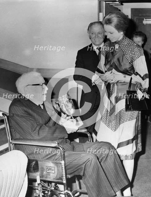 Princess Anne jokes with Sir Charles Chaplin after presenting him with an award, London, 1976. Artist: Unknown