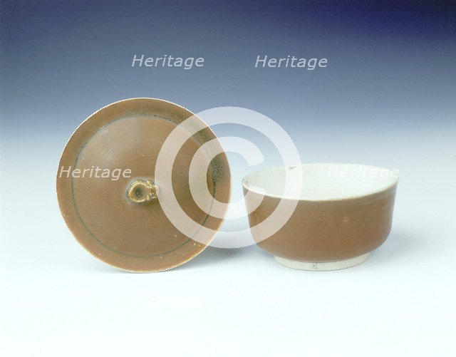 Ding persimmon red glazed covered bowl with white glazed interior, Jin dynasty, China, 12th century. Artist: Unknown