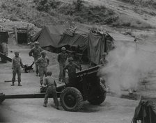 Vietnamese artillerymen fire from a mountain position during field training, 1962. Creator: United States Army.
