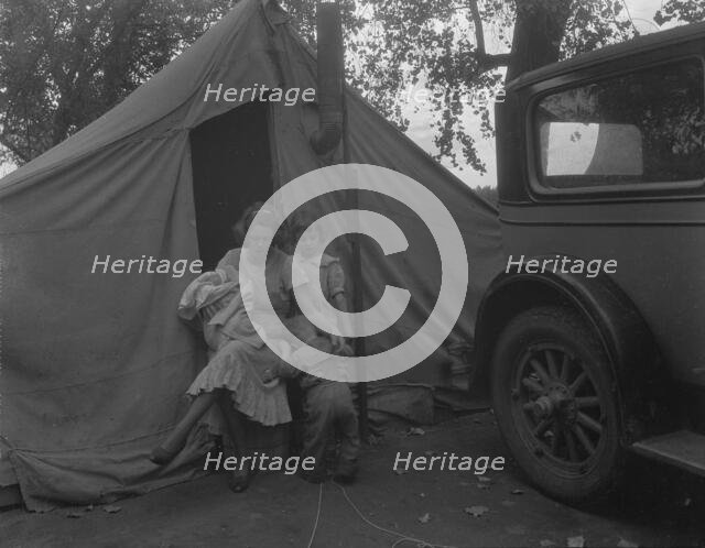 Mother and three children in a California squatter camp, 1936. Creator: Dorothea Lange.