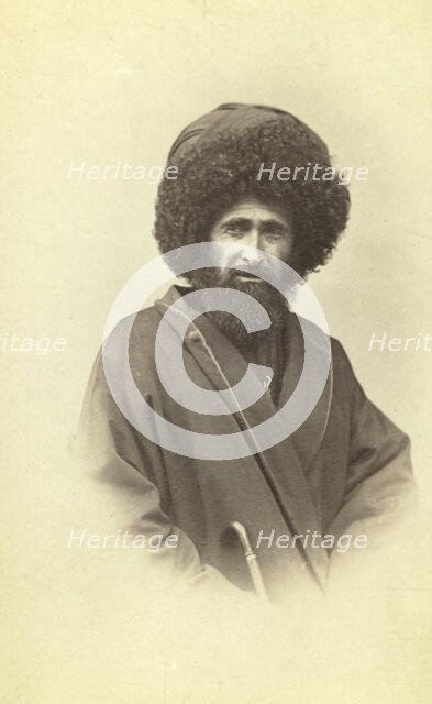 Half-length portrait of Georgian muezzin, facing front, between 1870 and 1886. Creator: Unknown.