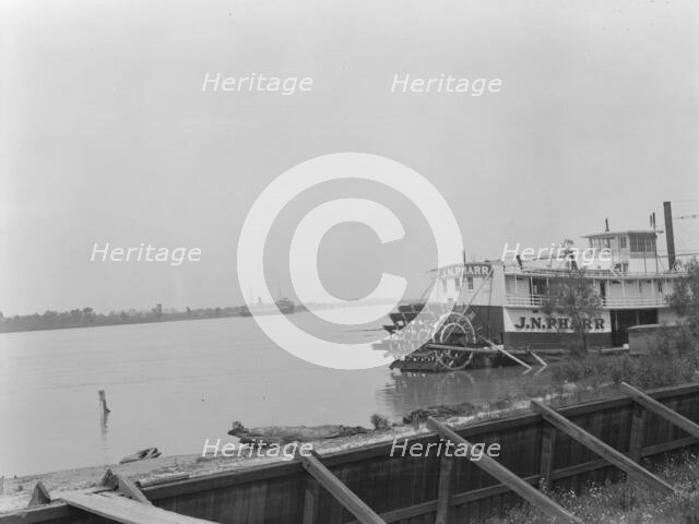 Paddle wheel steamboat on river, New Orleans, between 1920 and 1926. Creator: Arnold Genthe.