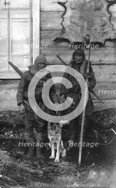 Two Chukchi in national clothes, with guns and a spear, 1910-1929. Creator: Ivan Emelianovich Larin.