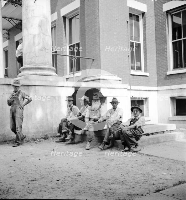 Saturday afternoon in front of the courthouse, Greenville [i.e., Greeneville], Tennessee, 1936. Creator: Dorothea Lange.