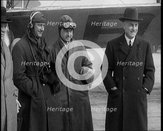 Four Male Civilians Standing in Front of a Plane, 1929. Creator: British Pathe Ltd.