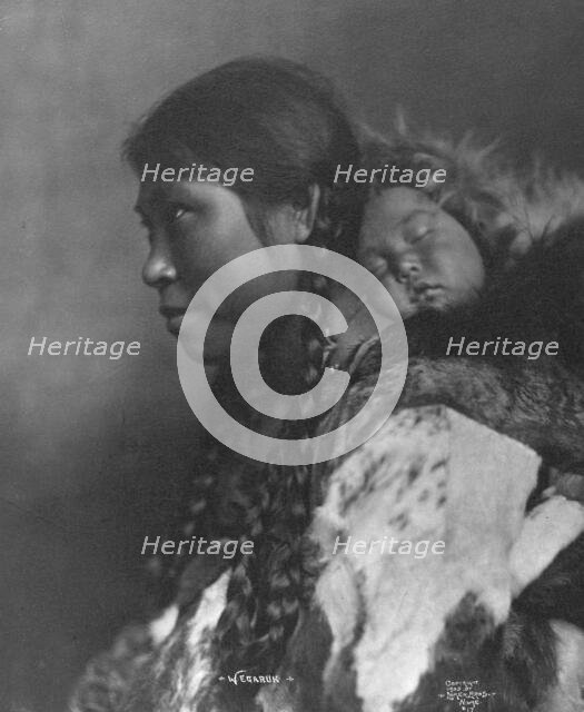 Eskimo mother and child , c1905, printed (1923?). Creator: Lomen Brothers.