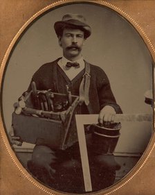 Carpenter Holding a Bag of Tools and a Square, 1880-90s. Creator: Unknown.