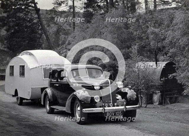 1936 Oldsmobile Eight with caravan in Scotland. Creator: Unknown.
