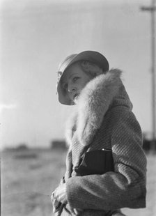Hamilton, Esther, standing outdoors, 1933 May. Creator: Arnold Genthe.