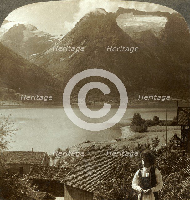 'Looking from Hjelle across quiet Strynns Lake to steep glaciers of Mt. Skaala, Norway', c1905. Creator: Unknown.