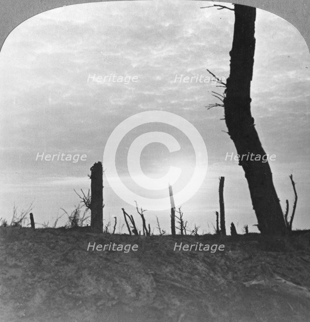 The Sun going down over 'no man's land' on the Somme, France, World War I, c1914-c1918. Artist: Realistic Travels Publishers