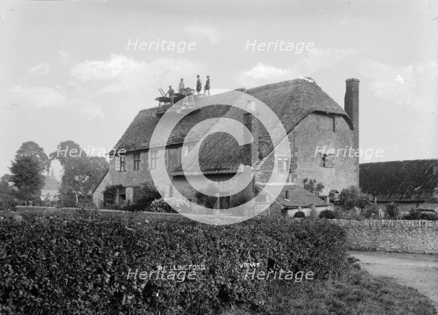 Workmen repairing a chimney of a cottage at Shellingford, Oxfordshire, c1860-c1922. Artist: Henry Taunt