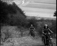 Female Civilians Riding Motorcycles on an Uphill Climb, 1931. Creator: British Pathe Ltd.