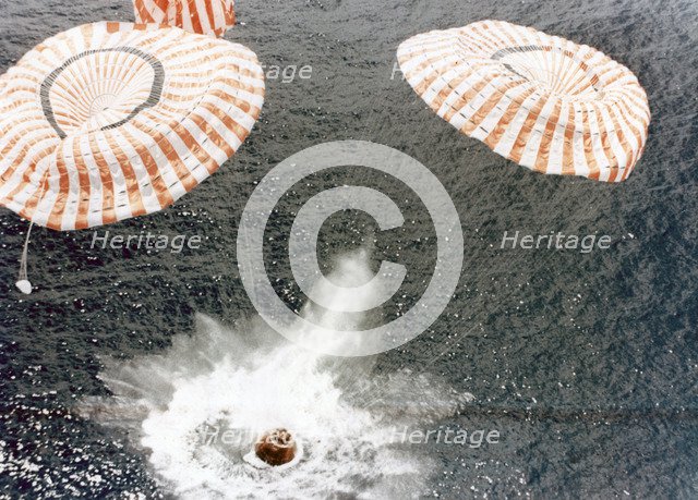 The Apollo 15 capsule lands safely despite a parachute failure, Mid-Pacific Ocean, 1971.Artist: NASA