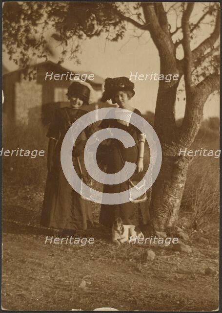 Portrait of Two Women Dressed Up in the Backyard, 1907-1943. Creator: Louis Fleckenstein.