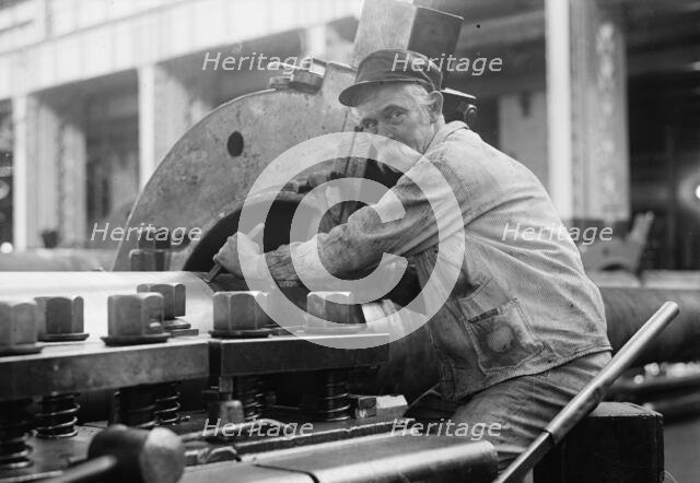 Navy Yard, U.S., Washington - Turning, Examining And Boring A 5 Inch, 50 Cal. Gun, 1917. Creator: Harris & Ewing.