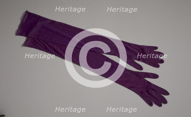 Pair of arm length purple gloves from Mae's Millinery Shop, 1941-1994. Creator: Van Raalte.