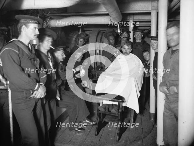 U.S.S. Brooklyn, barber shop, between 1896 and 1901. Creator: Unknown.