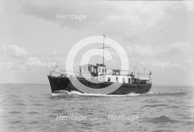 The motor yacht 'Black Arrow' under way, 1934. Creator: Kirk & Sons of Cowes.