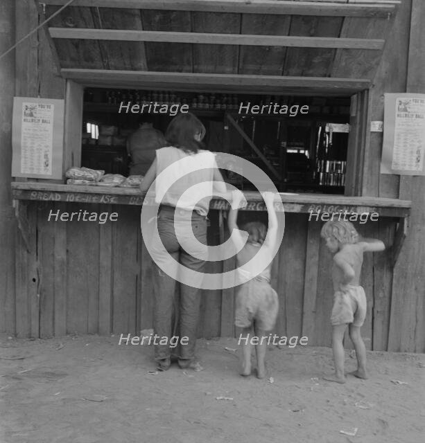 Hop picker with her children goes from..., near Grants Pass, Josephine County, Oregon, 1939. Creator: Dorothea Lange.