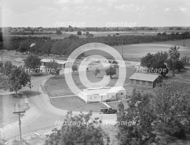 Entrance to camp showing clinic, Farmersville, California, 1939. Creator: Dorothea Lange.