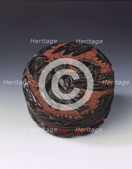 Carved black lacquer covered box on red ground, Ming dynasty, China, late 15th-early 16th century. Artist: Unknown