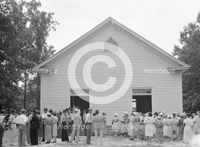 Congregation gathers in groups..., Wheeley's Church, Person County, North Carolina, 1939. Creator: Dorothea Lange.