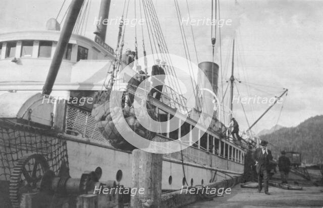 Loading copper on ship, between c1900 and 1916. Creator: Unknown.