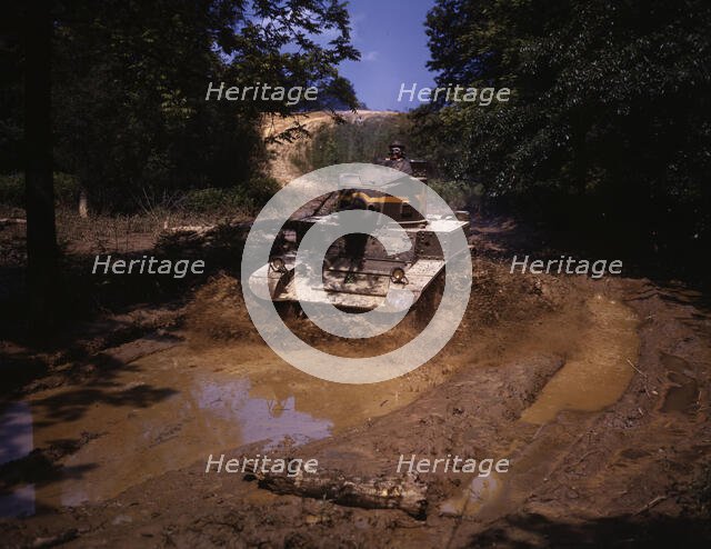 Light tank going through water obstacle, Ft. Knox, Ky., 1942. Creator: Alfred T Palmer.