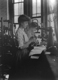 Shoe factories, Lynn, Mass.: 2 women working in shoe factory, (1895?). Creator: Frances Benjamin Johnston.