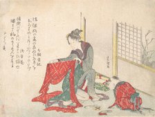 Woman Folding Cloth, late 18th-early 19th century. Creator: Hokusai.
