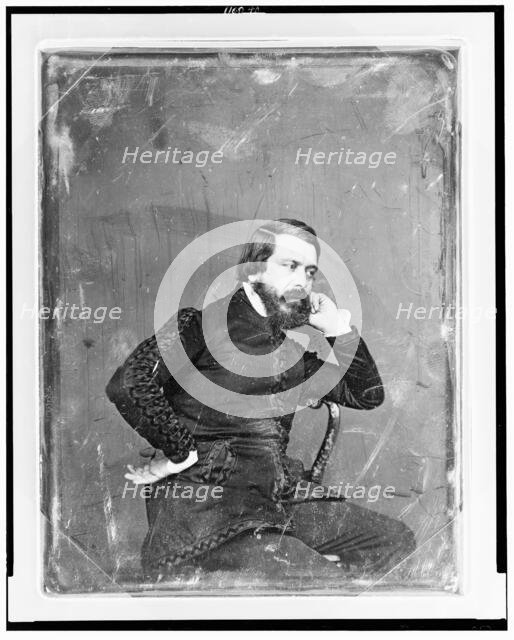 Unidentified man, three-quarter length portrait, three-quarters to the..., between 1844 and 1860. Creator: Mathew Brady.