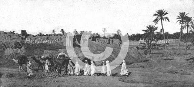 ''A Caravan approaching an old Fort in Biskra', 1890. Creator: Unknown.