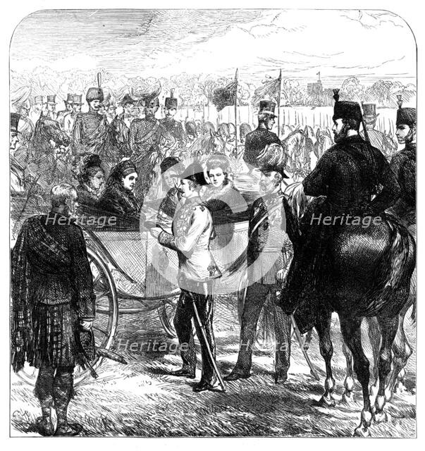 Review at Windsor: the Queen presenting the Cross of...St. George to Sir Garnet Wolseley, 1874. Creator: Unknown.