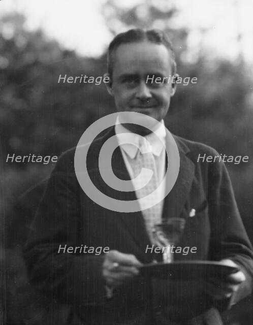 Dunning, Mr., standing outdoors, 1925 July 9. Creator: Arnold Genthe.